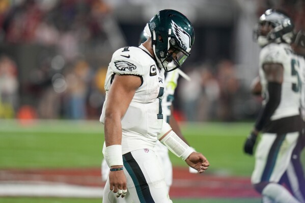 Philadelphia Eagles quarterback Jalen Hurts hangs his head after turning the ball over on downs to the Tampa Bay Buccaneers during the second half of an NFL wild-card playoff football game, Monday, Jan. 15, 2024, in Tampa, Fla. (AP Photo/Chris O'Meara)