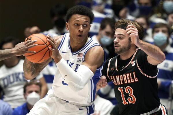 Campbell guard Austin McCullough (13) guards Duke forward Paolo Banchero during the first half of an NCAA college basketball game in Durham, N.C., Saturday, Nov. 13, 2021. (AP Photo/Gerry Broome)