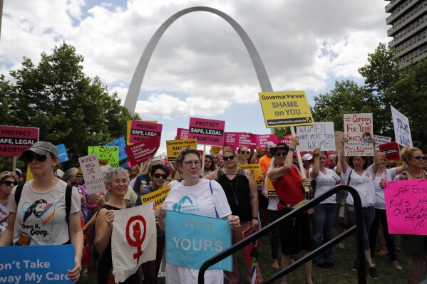 FILE - Abortion-rights supporters take part in a protest, May 30, 2019, in St. Louis. A Missouri abortion-rights campaign on Thursday, Jan. 18, 2024, announced it's throwing support behind an amendment to enshrine access in the state constitution while allowing the procedure to be restricted later in pregnancy. (AP Photo/Jeff Roberson, File)