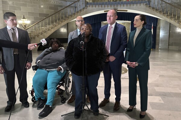 FILE - Oriel Moore describes life without her brother, 38-year-old Othel Moore Jr., to reporters Dec. 19, 2023, at the Missouri Capitol building in Jefferson City, Mo. The family of Othel Moore, who died in a Missouri prison, filed a lawsuit Tuesday, July 30, 2024, to get surveillance video of the moments leading up to his death. (AP Photo/Summer Ballentine, File)