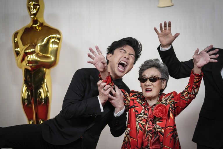Sean Wang, left, and Chang Li Hua arrive at the Oscars on Sunday, March 10, 2024, at the Dolby Theatre in Los Angeles. (AP Photo/Ashley Landis)