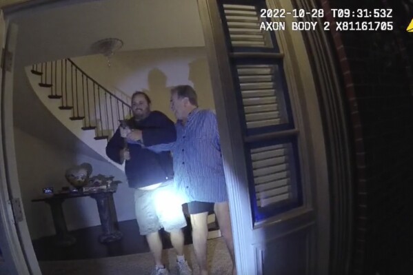 FILE - In this image taken from San Francisco Police Department body-camera video, the husband of former U.S. House Speaker Nancy Pelosi, Paul Pelosi, right, fights for control of a hammer with his assailant David DePape during a brutal attack in the couple's San Francisco home, on Oct. 28, 2022. DePape convicted of attempting to kidnap then-House Speaker Nancy Pelosi and attacking her husband with a hammer is set to be sentenced in federal court Friday, May 17, 2024. (San Francisco Police Department via Ǻ, File)