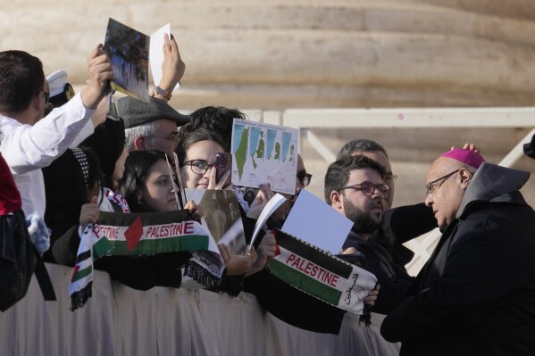 Members of Palestinian community attend at the Pope Francis' weekly general audience in St. Peter's Square, at the Vatican, Wednesday, Nov. 22, 2023. (AP Photo/Andrew Medichini)