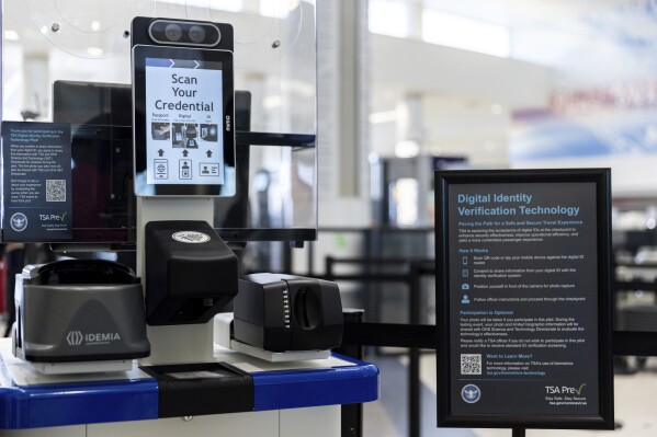 FILE - The Transportation Security Administration's new facial recognition technology is seen at a Baltimore-Washington International Thurgood Marshall Airport security checkpoint, April 26, 2023, in Glen Burnie, Md. A bipartisan group of senators wants restrictions on the use of facial recognition technology by the TSA, saying they're concerned about travelers' privacy and civil liberties.(AP Photo/Julia Nikhinson, File)