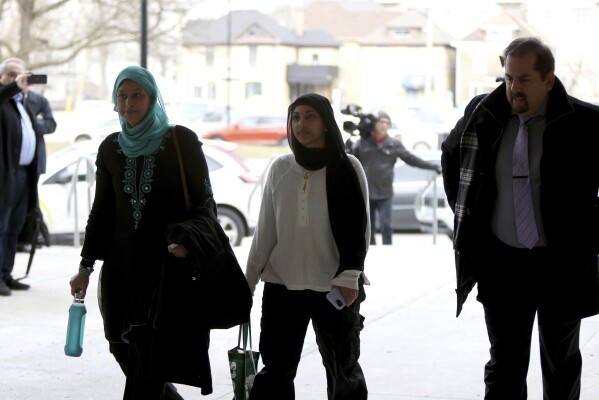 Supporters of the Afzaal family arrive at the London courthouse to attend the sentencing hearing of Nathaniel Veltman in London, Ont., Thursday, Feb. 22, 2024. Veltman, found guilty of using his pickup truck to kill four members of a Muslim family was sentenced to life in prison as a judge ruled that the actions of the “admitted white nationalist” amounted to terrorism. (Nicole Osborne /The Canadian Press via AP)