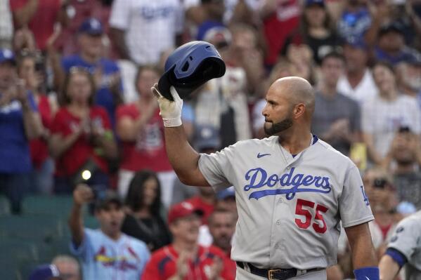 Los Angeles Dodgers' Albert Pujols tips his tap to cheering fans as he steps up to bat during the first inning of a baseball game against the St. Louis Cardinals Tuesday, Sept. 7, 2021, in St. Louis. (AP Photo/Jeff Roberson)