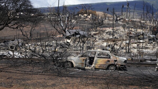 Destroyed property is seen, Sunday, Aug. 13, 2023, in Lahaina, Hawaii, following a deadly wildfire that caused heavy damage days earlier. (AP Photo/Rick Bowmer)