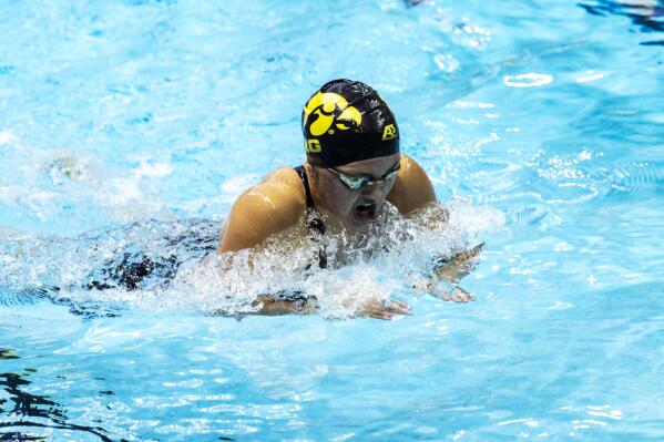 University of Iowa's Alexa Puccini competes in the 200-yard individual medley during an NCAA Big Ten Conference swimming and diving meet, Saturday, Jan. 16, 2021, in Iowa City, Iowa. In late 2020, several women's athletes at the University of Iowa sued after the school announced it was cutting men's and women's swimming and diving, men's tennis and men's gymnastics. Sage Ohlensehlen was a senior swimmer and headed up the lawsuit, while Alexa Puccini was a freshman swimmer. (Joseph Cress/Iowa City Press-Citizen via AP)