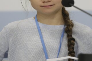 Climate activist Greta Thunberg participates in a news conference at the COP25 Climate summit in Madrid, Spain, Monday, Dec. 9, 2019. Thunberg is in Madrid where a global U.N.-sponsored climate change conference is taking place. (AP Photo/Andrea Comas)
