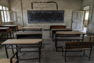 FILE - A classroom of a Hazara Shiite school sits empty in Kabul, Afghanistan, Sunday, July 31, 2022. The United Nations on Sunday, Sept. 18, 2022, called for Afghanistan's Taliban rulers to reopen schools to girls in grades 7-12, calling the anniversary of their exclusion from high school “shameful.” (AP Photo/Ebrahim Noroozi, File)