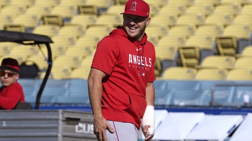 Los Angeles Angels Mike Trout laughs during batting practice prior to a baseball game against the Los Angeles Dodgers Friday, July 7, 2023, in Los Angeles. (AP Photo/Mark J. Terrill)