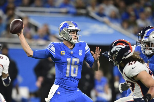 Detroit Lions quarterback Jared Goff (16) throws during the first half of an NFL football game against the Denver Broncos, Saturday, Dec. 16, 2023, in Detroit. (AP Photo/David Dermer)