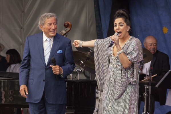 FILE - Tony Bennett, left, and Lady Gaga perform at the New Orleans Jazz & Heritage Festival, on April 26, 2015 in New Orleans. Bennett died Friday, July 21, 2023. at age 96. (Photo by Barry Brecheisen/Invision/AP, File)