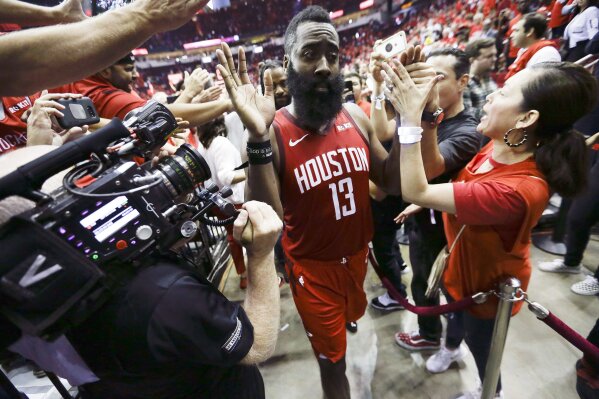 
              Houston Rockets guard James Harden (13) walks off the court after the team's overtime win over the Golden State Warriors during the Game 3 of a second-round NBA basketball playoff series, Saturday, May 4, 2019, in Houston. (AP Photo/Eric Christian Smith)
            