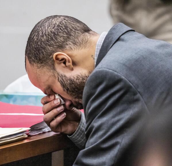 Defendant Darrell Brooks takes a moment to compose himself after making his opening statement to the jury during his trial in a Waukesha County Circuit Court in Waukesha, Wis., on Thursday, Oct. 20, 2022. Brooks, who is representing himself during the trial, is charged with driving into a Waukesha Christmas Parade last year, killing six people and injuring dozens more. (Scott Ash/Milwaukee Journal-Sentinel via AP, Pool)