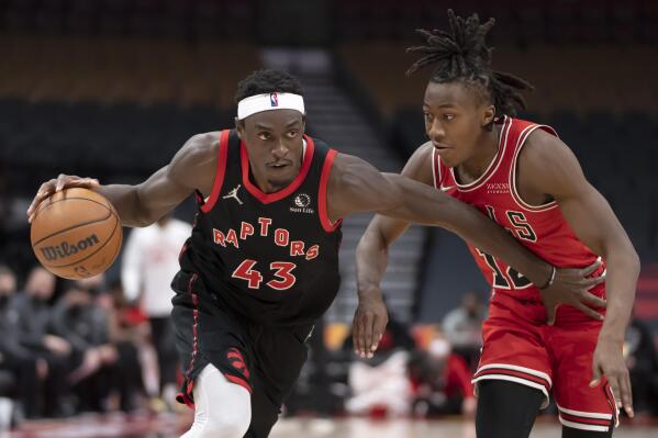Toronto Raptors forward Pascal Siakam (43) drives past Chicago Bulls guard Ayo Dosunmu (12) during the second half of an NBA basketball game Thursday, Feb. 3, 2022, in Toronto. (Frank Gunn/The Canadian Press via AP)