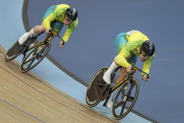 Matthew Glaetzer, right, of Australia leads compatriot Thomas Cornish in their men's sprint quarterfinals during the Commonwealth Games track cycling at Lee Valley VeloPark in London, Sunday, July 31, 2022. (AP Photo/Ian Walton)