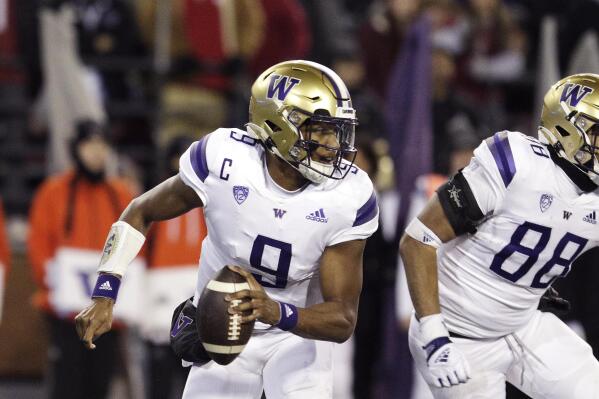 Washington quarterback Michael Penix Jr. (9) looks for a receiver during the second half of an NCAA college football game against Washington State, Saturday, Nov. 26, 2022, in Pullman, Wash. Washington won 51-33. (AP Photo/Young Kwak)