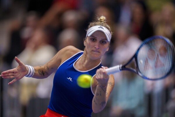 Czech Republic's Marketa Vondrousova returns the ball to US Sofia Kenin during their group stage tennis match at the Billie Jean King Cup finals at La Cartuja stadium in Seville, southern Spain, Spain, Friday, Nov. 10, 2023. (AP Photo/Manu Fernandez)