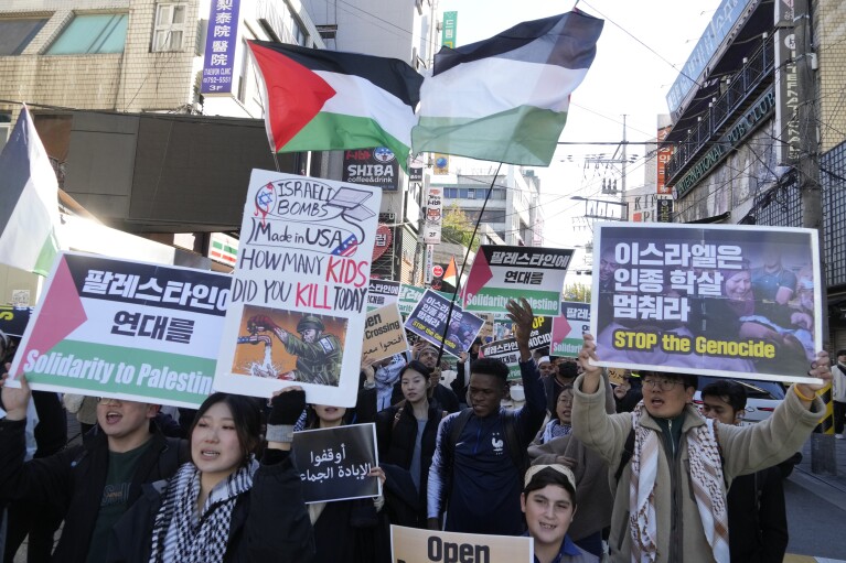 FILE - Supporters for Palestinian people march during a rally to urge Israel to suspend attacks on the Gaza Strip, in Seoul, South Korea on Nov. 10, 2023. (AP Photo/Ahn Young-joon, File)