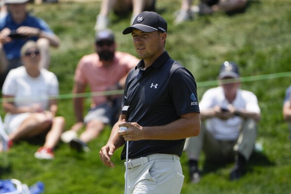 Jordan Spieth walks on the first green during the second round of the Travelers Championship golf tournament at TPC River Highlands, Friday, June 21, 2024, in Cromwell, Conn. (AP Photo/Seth Wenig)