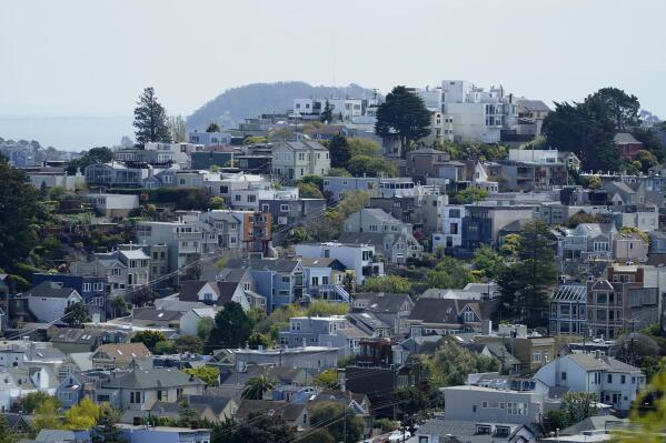 Residential properties are shown on a hill in San Francisco, Tuesday, April 18, 2023. On Thursday, the National Association of Realtors reports on sales of existing homes in March. (AP Photo/Jeff Chiu)