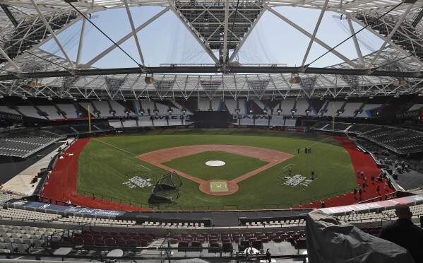 FILE - General view at the pitch during an unveiling of the London Stadium in London, on June 27, 2019. The baseball field being installed at London Stadium will be slightly bigger than the one in 2019. The St. Louis Cardinals and Chicago Cubs will play two games at the home of Premier League club West Ham next weekend. (AP Photo/Frank Augstein, File)