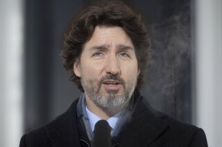 Canadian Prime Minister Justin Trudeau speaks during a news conference outside Rideau cottage in Ottawa, Ontario, Tuesday, Jan. 19, 2021. (Adrian Wyld/The Canadian Press via AP)