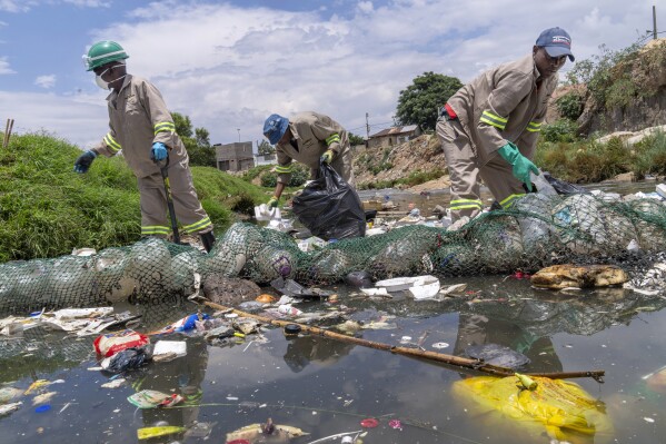 Alexandra Water Warriors volunteers cleanup the Juksei river in the heart of Alexandra township from plastic pollution in Johannesburg, South Africa, Nov. 27, 2024. (AP Photo/Jerome Delay, File)