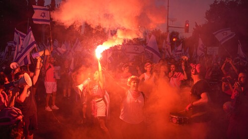 Israelis protest against plans by Prime Minister Benjamin Netanyahu's government to overhaul the judicial system in Tel Aviv, Israel, Saturday, July 15, 2023. (AP Photo/Ariel Schalit)