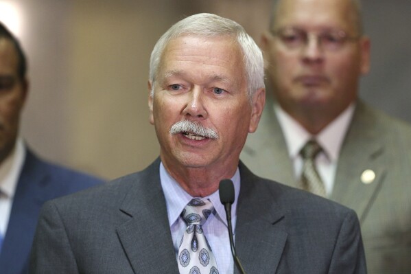 City council member Jack Sandlin speaks during a press conference about future legislation that will protect off-duty Indiana police officers at the Indiana State House, Indianapolis, Tuesday, Aug. 2, 2016. Sandlin, a retired police officer who had represented parts of Indianapolis and its southern suburbs since 2016, died Wednesday, Sept. 20, 2023, his press secretary said. He was 72. (The Indianapolis Star via AP)