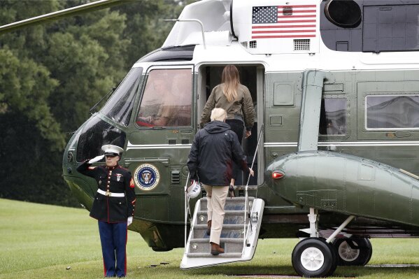 
              President Donald Trump and first lady Melania Trump board Marine One on the South Lawn of the White House in Washington, Tuesday, Aug. 29, 2017, for a short trip to Andrews Air Force Base, Md. then onto Texas to view the federal government's response to Harvey's devastating flooding in Texas. (AP Photo/Jacquelyn Martin)
            