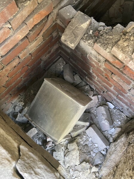This photo provided by the U.S. Military Academy at West Point, shows a time capsule uncovered, Friday, June 9, 2023. The long-forgotten time capsule, a small lead box measuring about a cubic foot, was discovered in May 2023, during restoration to a monument honoring Revolutionary War hero Thaddeus Kosciuszko, on the grounds of West Point, in New York. The box will be opened during a livestreamed event, Monday, Aug. 28. (Christopher Hennen/U.S. Army via AP)