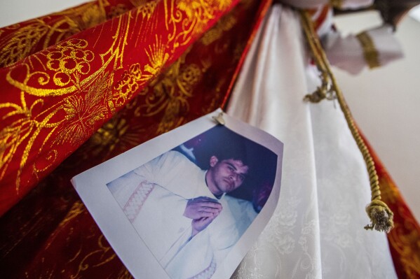 FILE - A photo of Bishop Rolando Alvarez is pinned to a robe on a statue of Jesus Christ at the Cathedral in Matagalpa, Nicaragua, Friday, Aug. 19, 2022. Many of the senior leaders of the Catholic Church in Nicaragua, including Álvarez who was jailed for more than a year, were released from prison and sent overseas in negotiations with the Vatican in January 2024. A dozen jailed priests had similarly been sent to the Vatican in October 2023. (AP Photo/Inti Ocon, File)