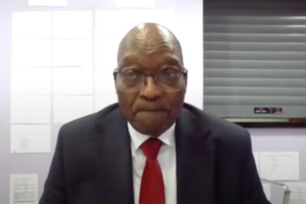 In this Frame grab former South Africa President Jacob Zuma, appears on a screen virtually from the correctional service facility Estcourt, in Pietermaritzburg, South Africa, Monday July 19, 2021, where his corruption trial resumes. The trial continued more than a week after Zuma's imprisonment for contempt of court in a separate case set off rioting. (South Africa Judiciary via AP)