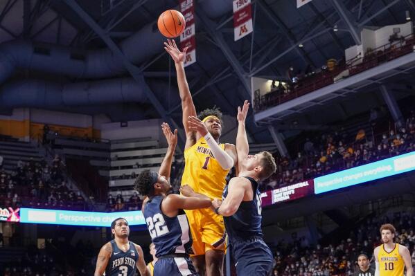 Minnesota forward Eric Curry (1) takes a shot over Penn State guard Jalen Pickett (22) and forward John Harrar during the first half an NCAA college basketball game Saturday Feb. 12, 2022, in Minneapolis. (AP Photo/Craig Lassig)