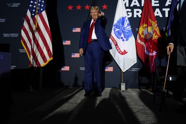 Republican presidential candidate former President Donald Trump acknowledges a supporter at a campaign rally, Tuesday Aug. 8, 2023, at Windham High School in Windham, N.H. (AP Photo/Robert F. Bukaty)