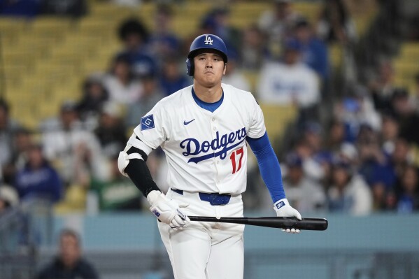 Los Angeles Dodgers' Shohei Ohtani reacts after striking out during the eighth inning of a baseball game against the Athletics, Thursday, May 15, 2025, in Los Angeles. (AP Photo/Mark J. Terrill)