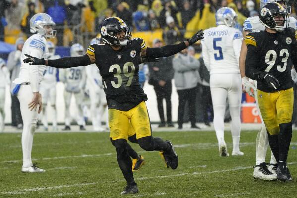CORRECTS NAME OF KICKER TO RYAN SANTOSO INSTEAD OF ZANE GONZALEZ - Detroit Lions kicker Ryan Santoso (5) walks off the field after missing a field goal-attempt, as Pittsburgh Steelers free safety Minkah Fitzpatrick (39) celebrates during the overtime period of an NFL football game, Sunday, Nov. 14, 2021, in Pittsburgh. (AP Photo/Keith Srakocic)
