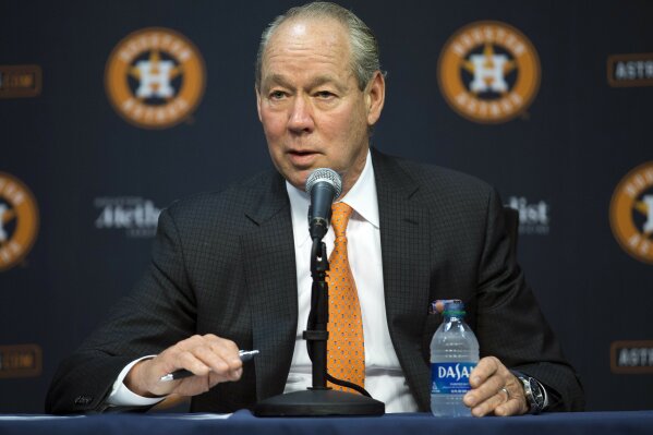 Houston Astros owner Jim Crane and Houston Astros manager Dusty Baker Jr.,  right, present a jersey to President Joe Biden during an event celebrating  the 2022 World Series champion Houston Astros baseball