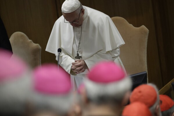 FILE - Pope Francis prays at the beginning of the third day of a Vatican's conference on dealing with sex abuse by priests, at the Vatican, Saturday, Feb. 23, 2019. Five years ago this week, Francis convened an unprecedented summit of bishops from around the world to impress on them that clergy abuse was a global problem and they needed to address it, but now, five years later, despite new church laws to hold bishops accountable and promises to do better, the Catholic Church's in-house legal system and pastoral response to victims has proven again to be incapable of dealing with the problem. (AP Photo/Alessandra Tarantino, Pool, file)