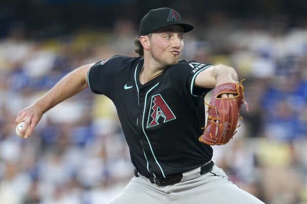 Arizona Diamondbacks pitcher Brandon Pfaadt throws to a Los Angeles Dodgers batter during the first inning of a baseball game Tuesday, May 21, 2024, in Los Angeles. (AP Photo/Marcio Jose Sanchez)
