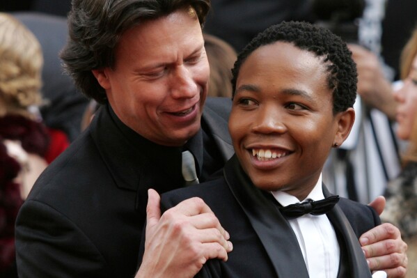 Director Gavin Hood, left, and actor Presley Chweneyagae from the best foreign language film "Tsotsi" from South Africa, arrive for the 78th Academy Awards on March 5, 2006, in Los Angeles. (AP Photo/Chris Carlson, file)