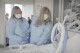 Relatives of Maurice “Mo” Miller, Mary Miller-Duffy, his sister, right, and her wife, Sue Duffy, stand with his body at NYU Langone Health in New York on Tuesday, Sept. 12, 2023. “I’m so proud of you,” Miller-Duffy said in a tearful farewell. For a history-making 61 days and despite a brief rejection blip, a pig’s kidney worked normally inside his brain-dead body. (AP Photo/Shelby Lum)