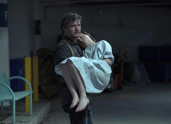 This image released by HBO shows Pedro Pascal, left, and Bella Ramsey in a scene from the series 