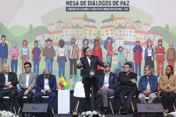 FILE - Colombia's President Gustavo Petro speaks during a ceremony to formally begin a six-month cease-fire as part of a process to forge a permanent peace between the National Liberation Army or ELN and the government, in Bogota, Colombia, Aug. 3, 2023. Petro aims to rewire how the South American nation addresses endemic violence, replacing military operations with social programs tackling the conflict’s roots, including poverty in violence-torn areas. (AP Photo/Ivan Valencia, File)