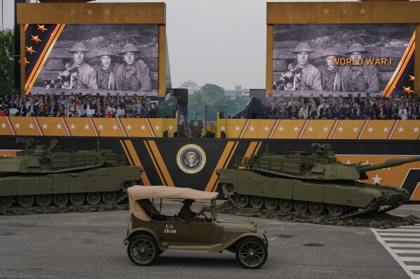 A World War I era vehicle passes the reviewing stand as President Donald Trump attends a military parade commemorating the Army's 250th anniversary, coinciding with his 79th birthday, Saturday, June 14, 2025, in Washington. (AP Photo/Julia Demaree Nikhinson)