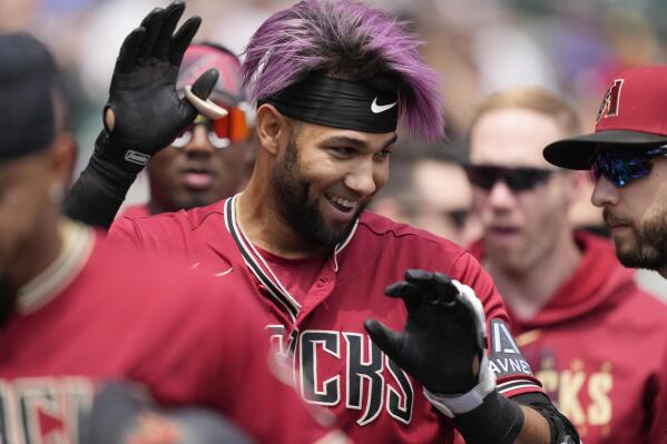 Arizona Diamondbacks designated hitter Lourdes Gurriel Jr. is greeted in the dugout after hitting a three-run home run during the fifth inning of a baseball game against the Detroit Tigers, Saturday, June 10, 2023, in Detroit. (AP Photo/Carlos Osorio)