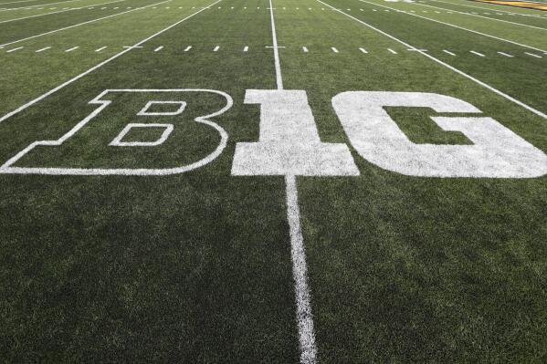 FILE - The Big Ten logo is displayed on the field before an NCAA college football game between Iowa and Miami of Ohio in Iowa City, Iowa., on Aug. 31, 2019. The Big Ten announced Thursday, Aug. 18, 2022, that it has reached seven-year agreements with Fox, CBS and NBC to share the rights to the conference's football and basketball games. (AP Photo/Charlie Neibergall, File)