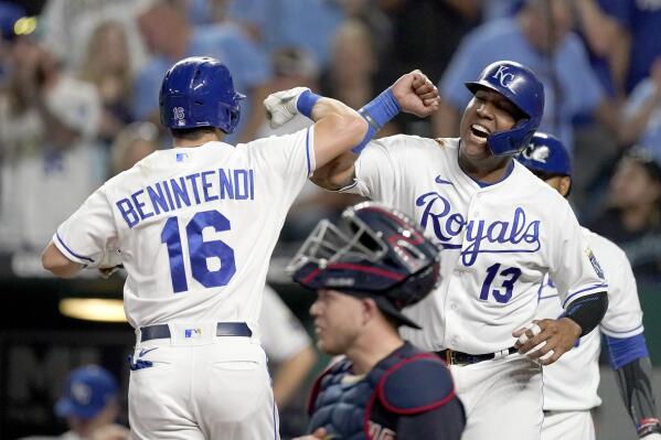Kansas City Royals' Andrew Benintendi (16) celebrates with Salvador Perez (13) after hitting a two-run home run during the first inning of a baseball game against the Cleveland Indians Tuesday, Sept. 28, 2021, in Kansas City, Mo. (AP Photo/Charlie Riedel)